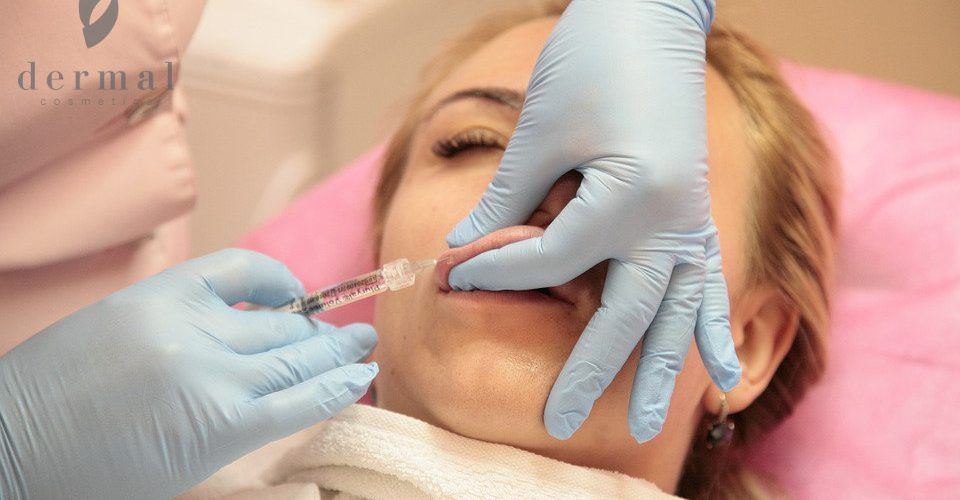 Woman getting lip filler injection